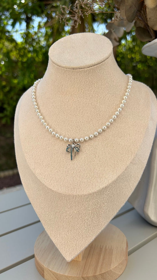 Grace in Every Detail: Pearl Necklace with Silver Bow Charm