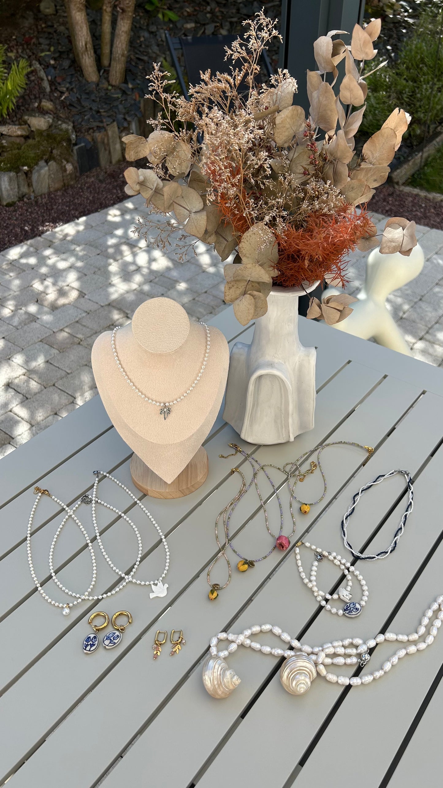 Grace in Every Detail: Pearl Necklace with Silver Bow Charm