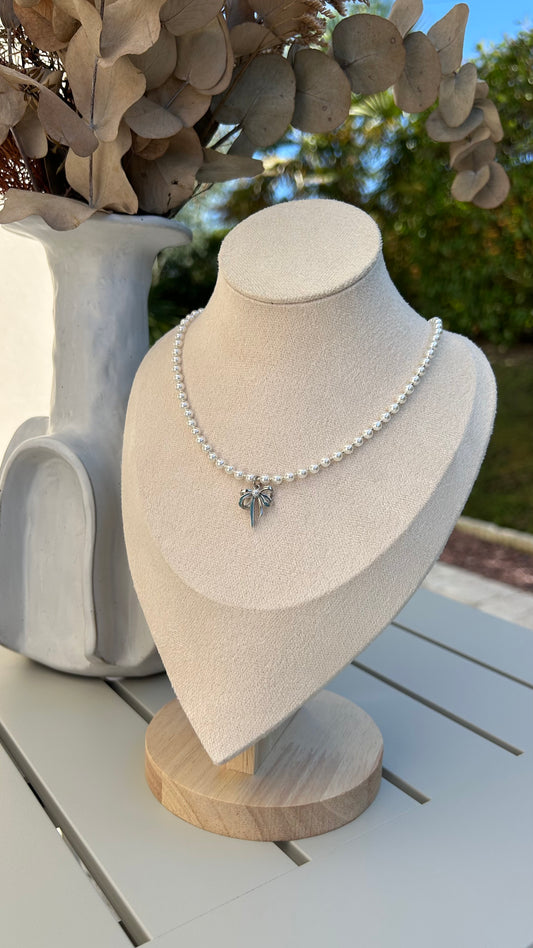 Grace in Every Detail: Pearl Necklace with Silver Bow Charm